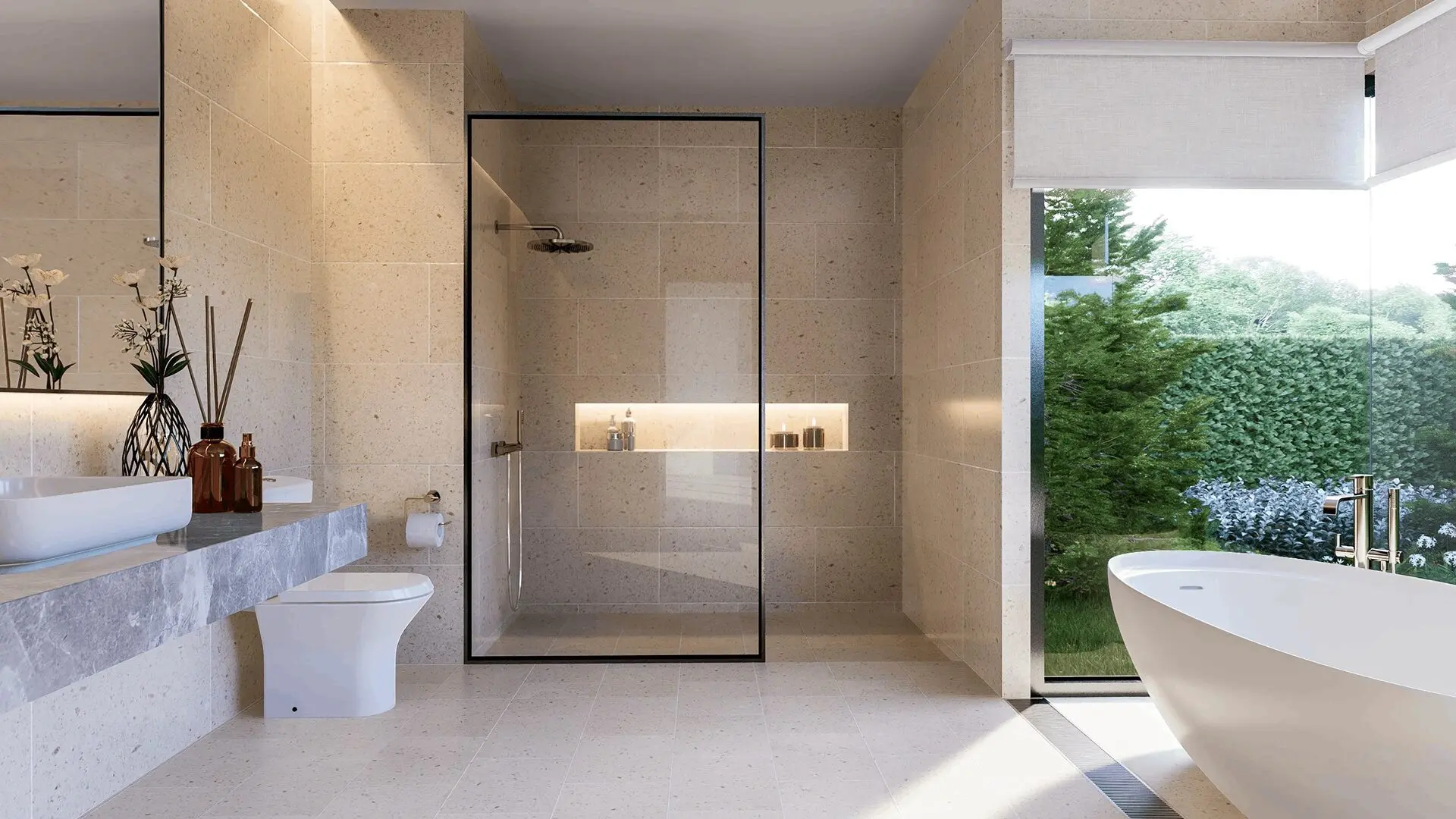 Modern bathroom with a freestanding tub, glass-enclosed shower, and large window. Beige stone tiles line the walls and floor. A countertop with a sink and toiletries is on the left.